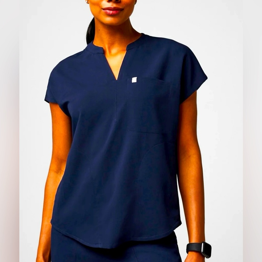 NWT Fabletics evolve scrub top size small navy
Still in bag